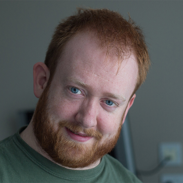 Person with red hair and green shirt.