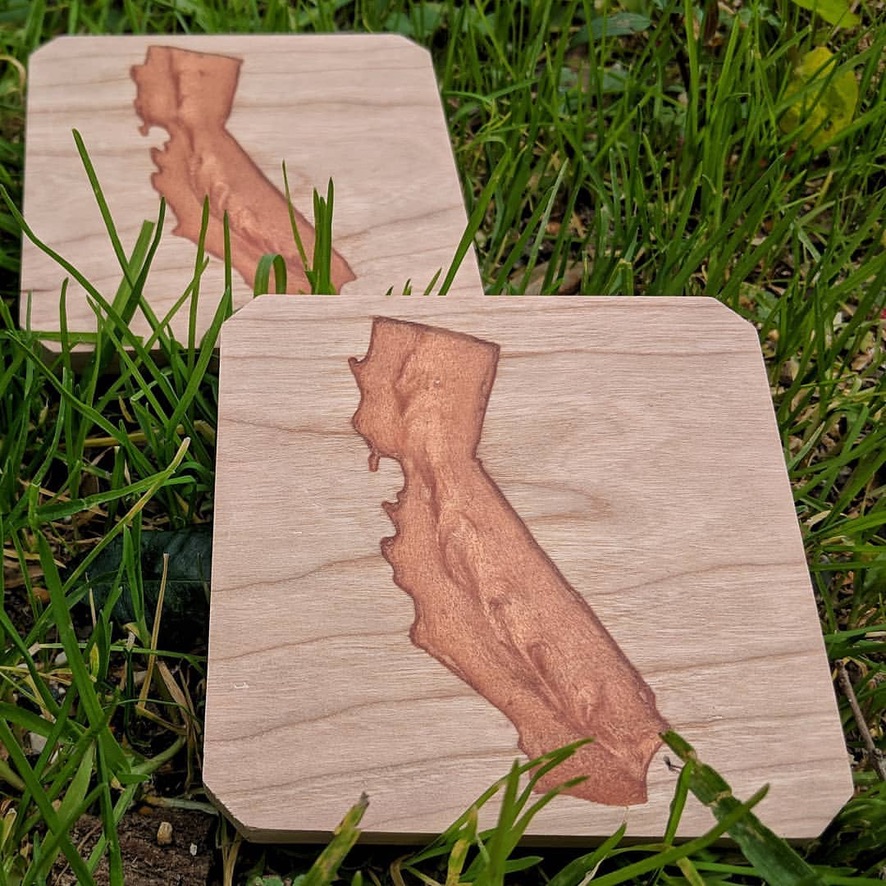 Two coasters with engravings of California