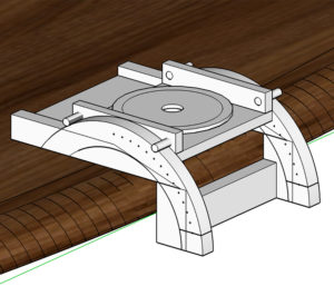 Image of rendered white and gray jig on a dark brown curved wooden table top