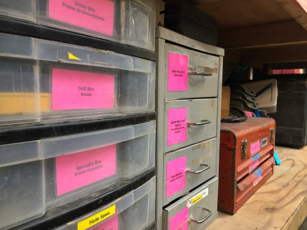 Pink labels on storage containers. 