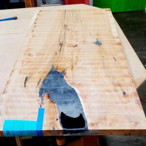 Hand planed table top with excess resin removed. 