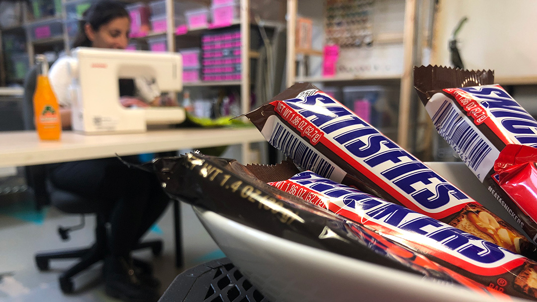 Person sewing, snacks