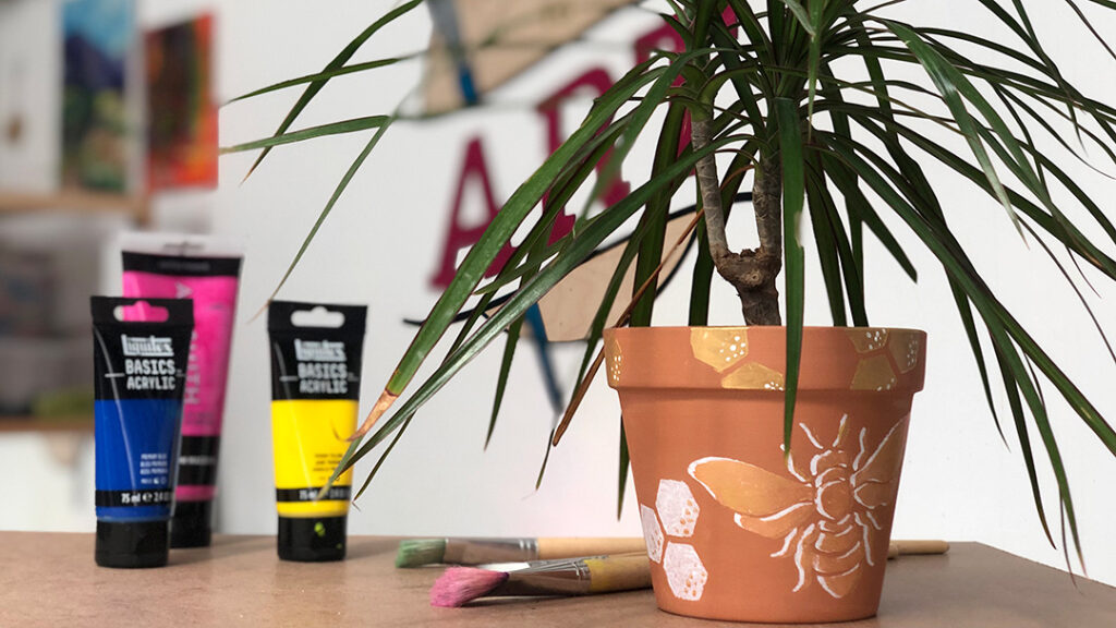 Painted pot, plant, paint, brushes