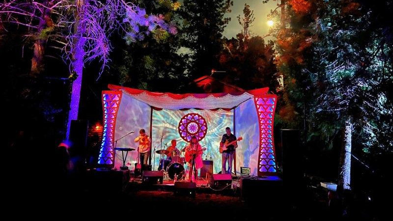 LED lit, laser-cut stage with performers