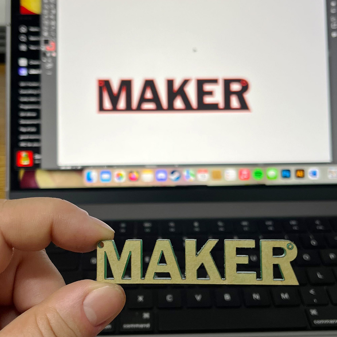 Laser-cut "MAKER" and design file. 