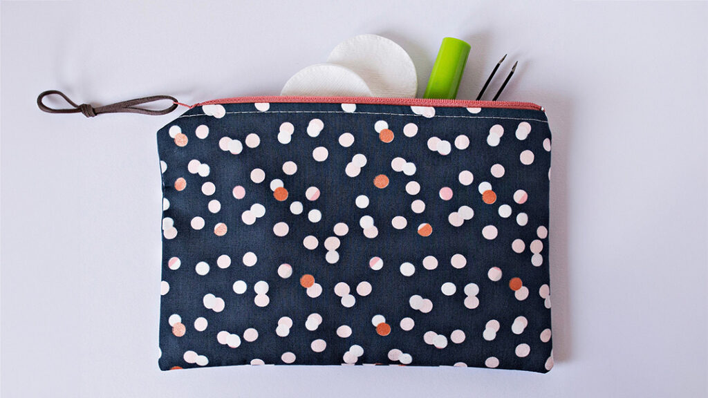 Polka-dot zipper pouch, make-up tools.