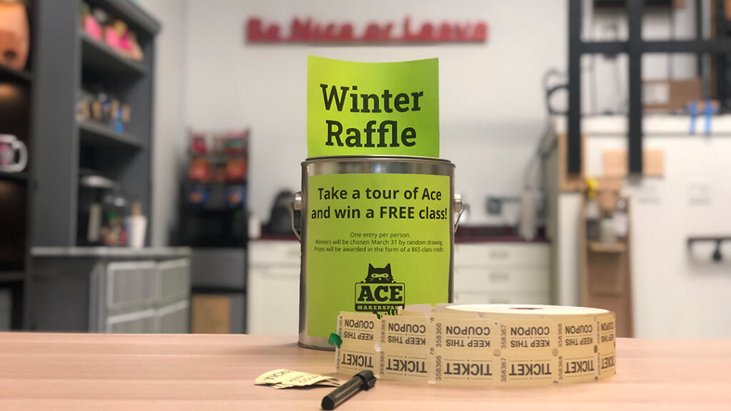 Green "Winter Raffle" sign on tin, raffle tickets, pen