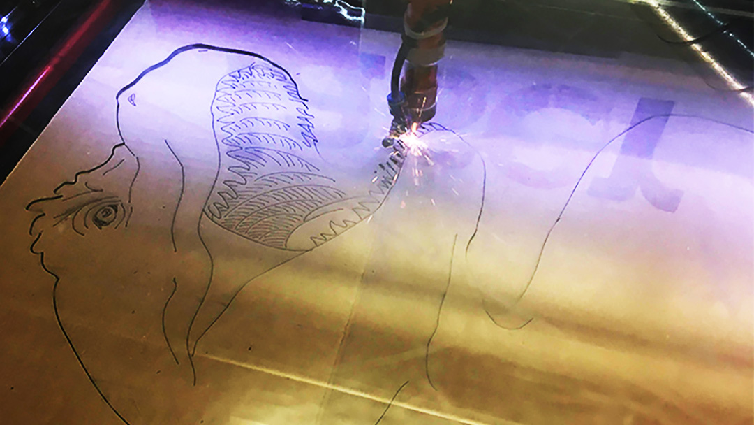 Laser-etched T-Rex on Cardboard
